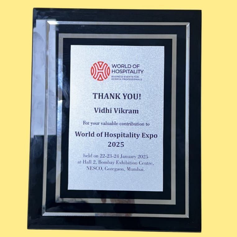 An image of World of Hospitality 2025 award  won by Vidhi Kamat - Kamats India