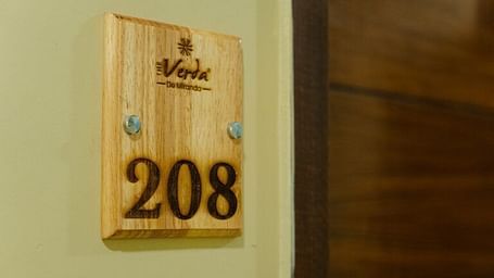 The picture showcasing the door of the verda hotel, titiled 208.