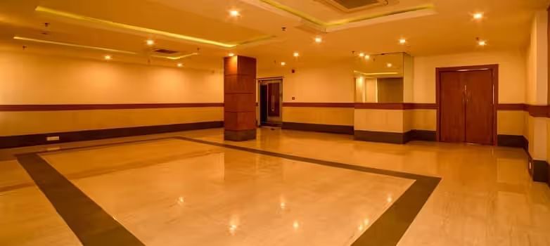 View of banquet hall called The Durbar with polished flooring and ample space for events - Max Hotel Prayagraj.