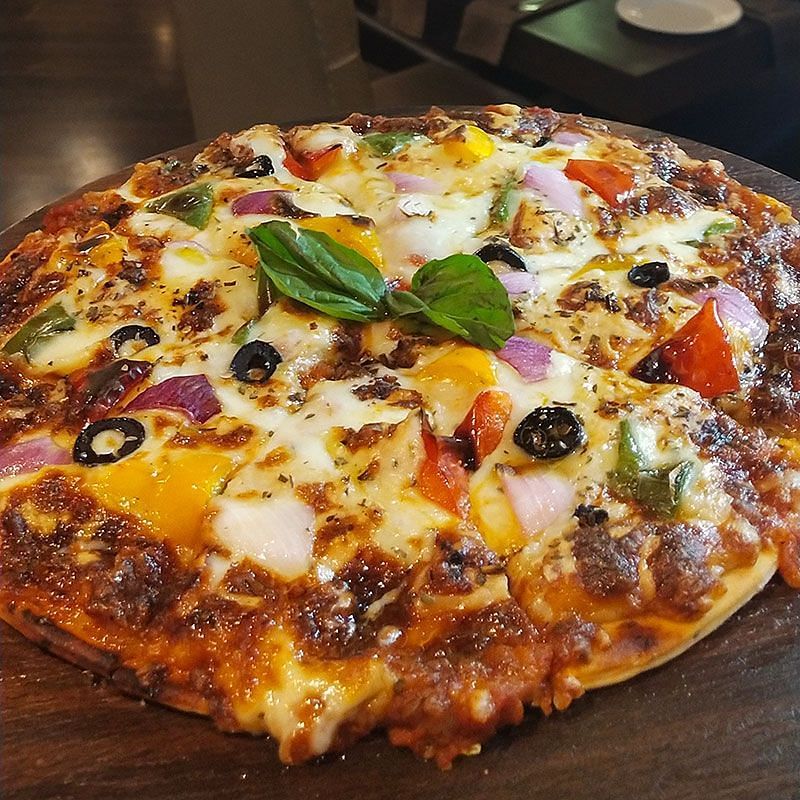 alt-text pizza marinara offered at Ginger, a restaurant in Shillong