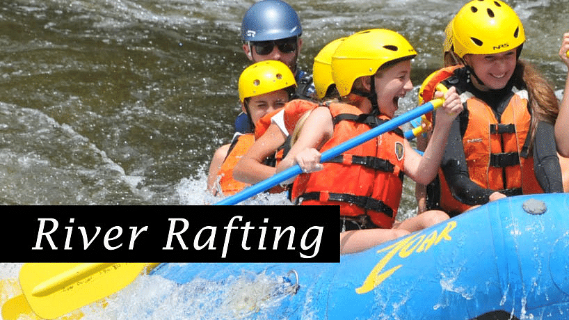 A group of friends river rafting in Manali