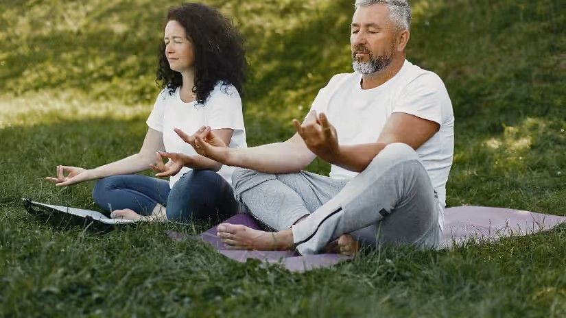 AN old couple doing yoga - YO1 Longevity Health Resorts