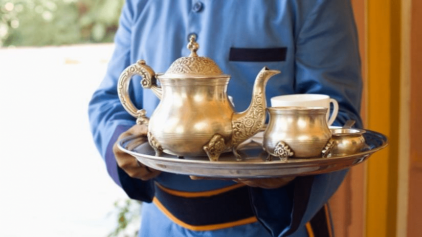 an image of a butler brings food and drinks to room - Rhythm Lonavala