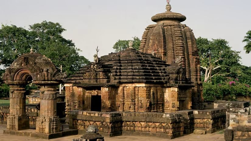 Exteriors of Mukteshvara Temple with a forest in the backdrop