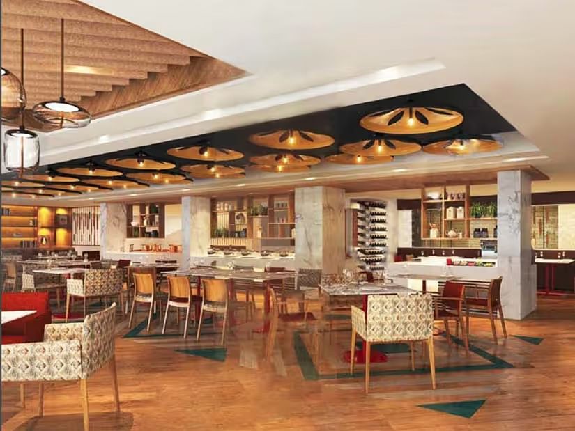 Dining area with tables set and ready, featuring culinary dishes prepared for serving guests.