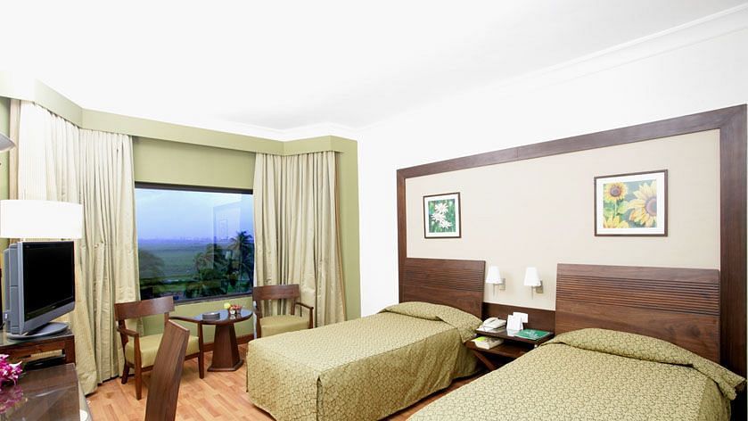twin beds in the Deluxe Room at The Retreat Hotel and Convention Centre Madh Island Mumbai
