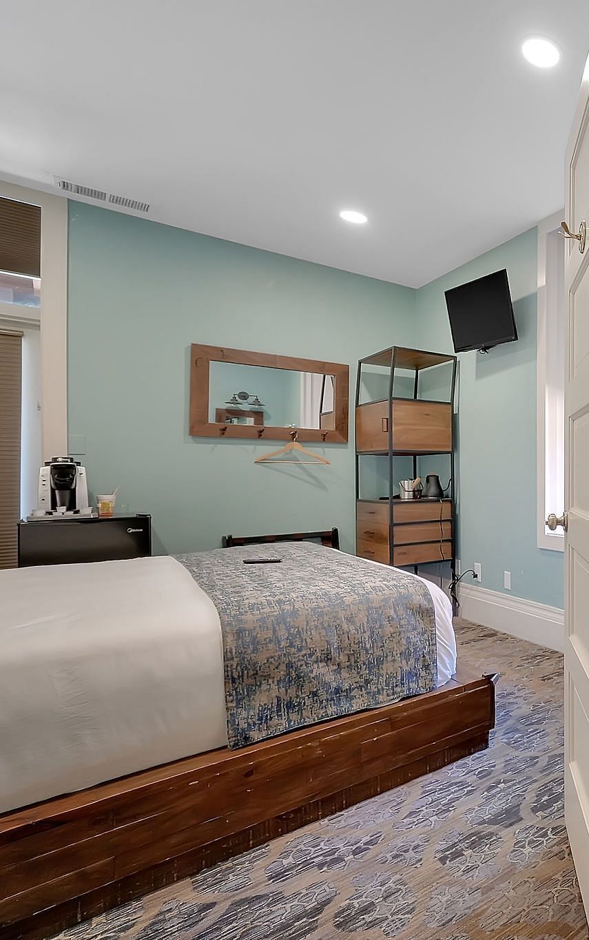 A view of a room at The Groveland Hotel with a double bed.