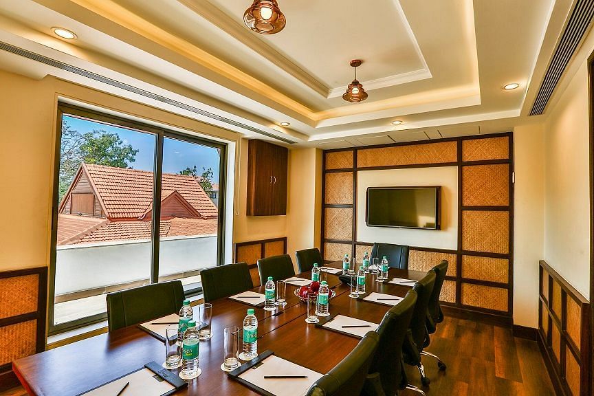 an image of a Meeting Room with a television and projector- Rhythm Lonavala