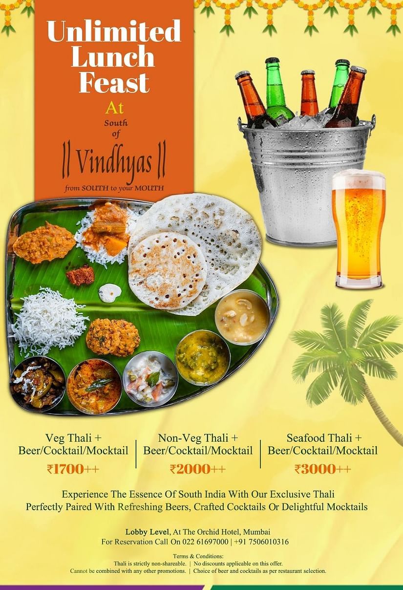 Banner for Unlimited Lunch Feast showcasing buffet spread with a variety of South Indian dishes including thalis, curries, and desserts as well as beverages