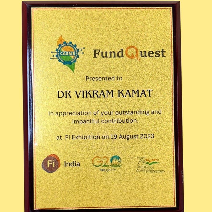 An accolade of Fund Quest presented to Dr. Vikram Kamat - Kamats India