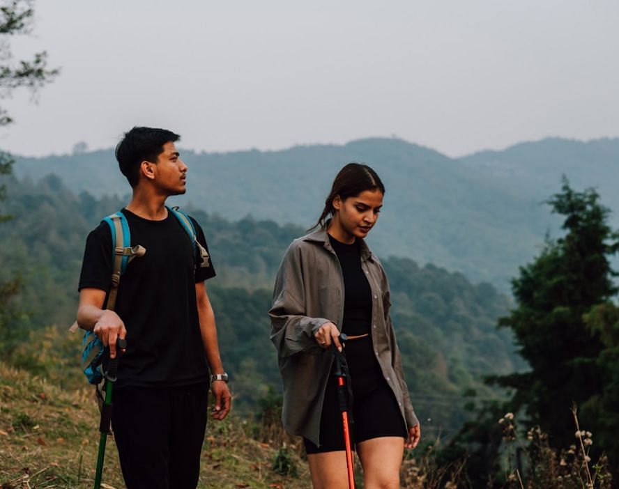 A girl and a boy walking on the hill | Kavya Resort and Spa, Nagark