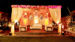 a decorated wedding mandap in an outdoor setting - polo floatel kolkata
