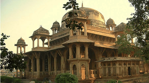 Facade of a brown coloured Tansen tomb