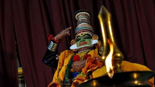 a Kathakali dancing theatre in kochi with a dancer performing