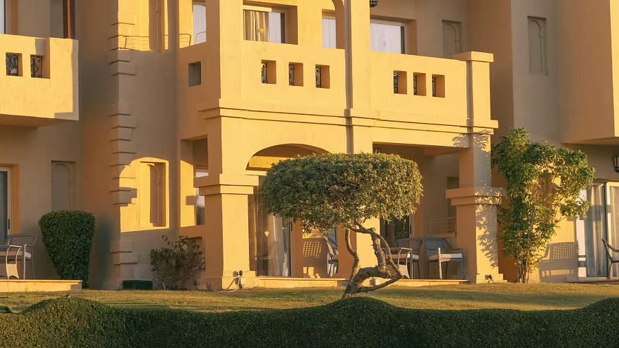 A resort building with a warm, golden hue at sunset.