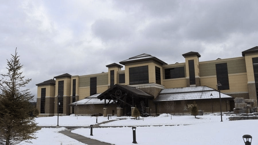 Exterior view of YO1 Longevity & Health Resorts in the Catskills covered in winter snow.