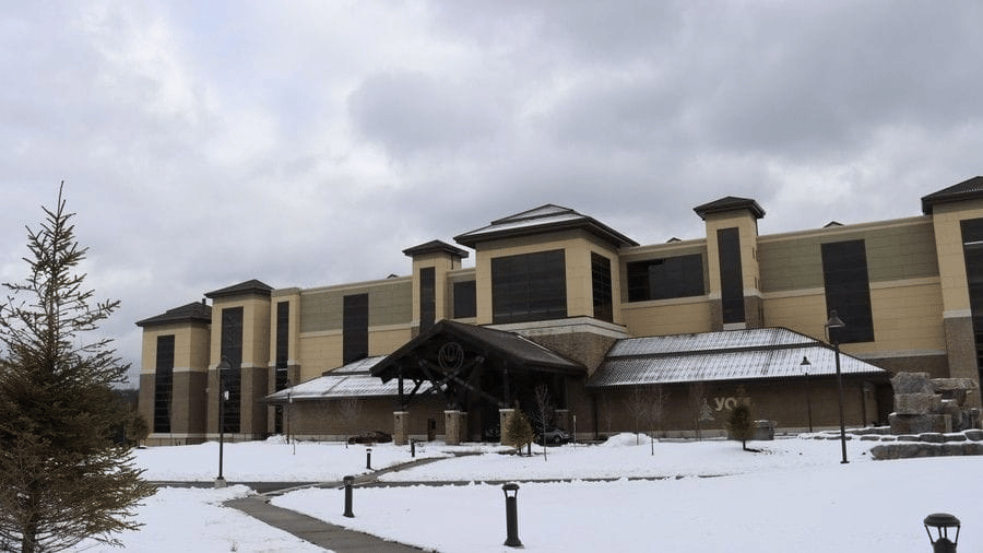 Exterior view of YO1 Longevity & Health Resorts in the Catskills covered in winter snow