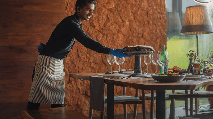Chef serving food at a villa for family in Goa