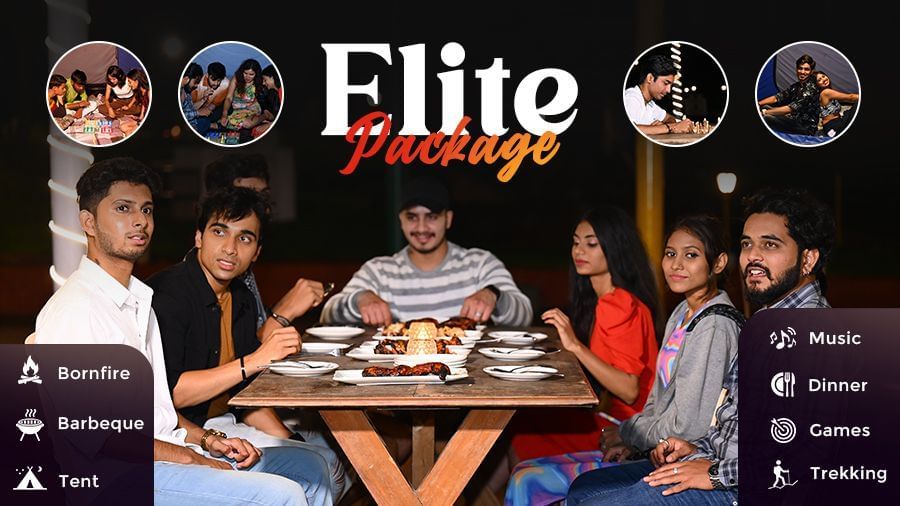 Creative of Elite Package featuring a group sitting on a table with food. The package offers bonfire, tent, barbeque, music, dinner, games, and trekking.