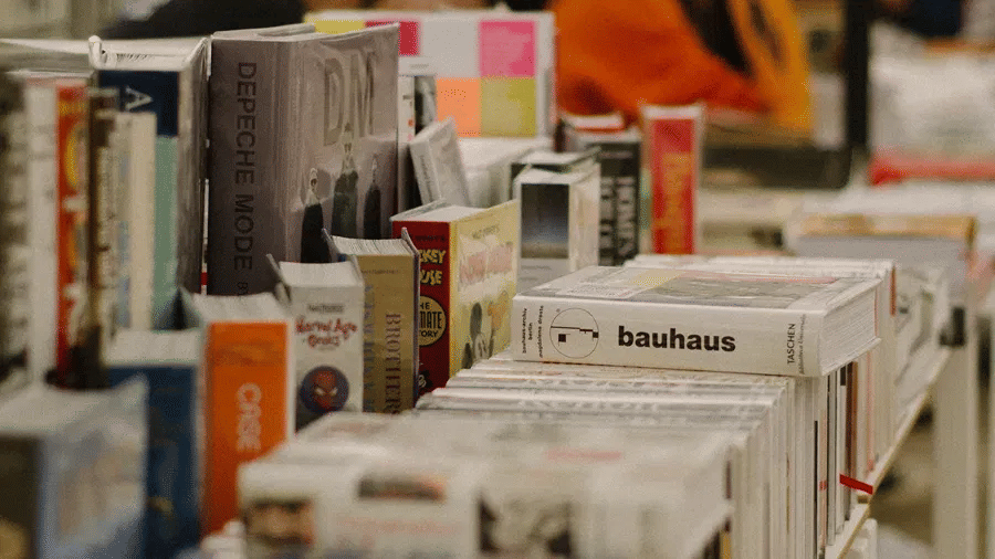 An overview of a second hand bookstore with many books stacked on top of each other