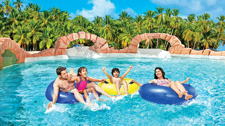 Water Kingdom - a family of 4 relaxing in a pool at our water park