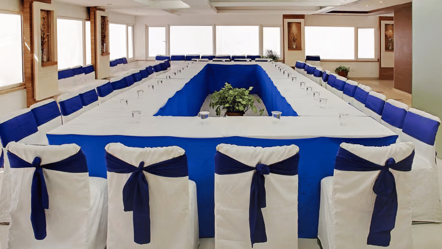 A banquet hall with chairs and tables.