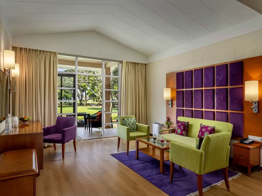 Overview of the Garden Villa with sofas and coffee table view - Caravela Beach Resort Goa