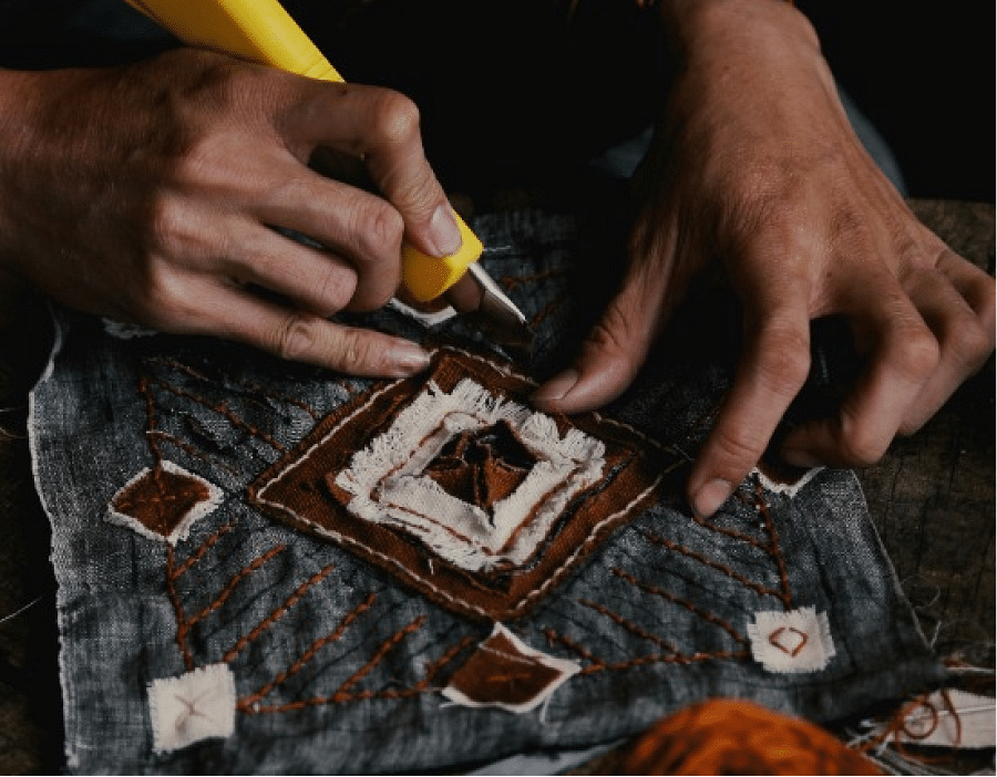 A image of a person crafting miniature of a reigious structure | Kavya Resort and Spa, Nagarkot