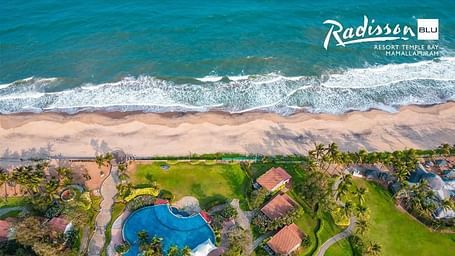 Panoramic view of pool and beach for corporate retreats - Radisson Blu Resort, Temple Bay Mamallapuram
