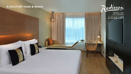 Promotional creative displaying an elegant guest room for the Elevate Your Stay offer.