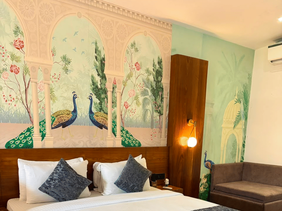 Emperor Room, Sofa and wardrobe alongside the muralled headboard wall