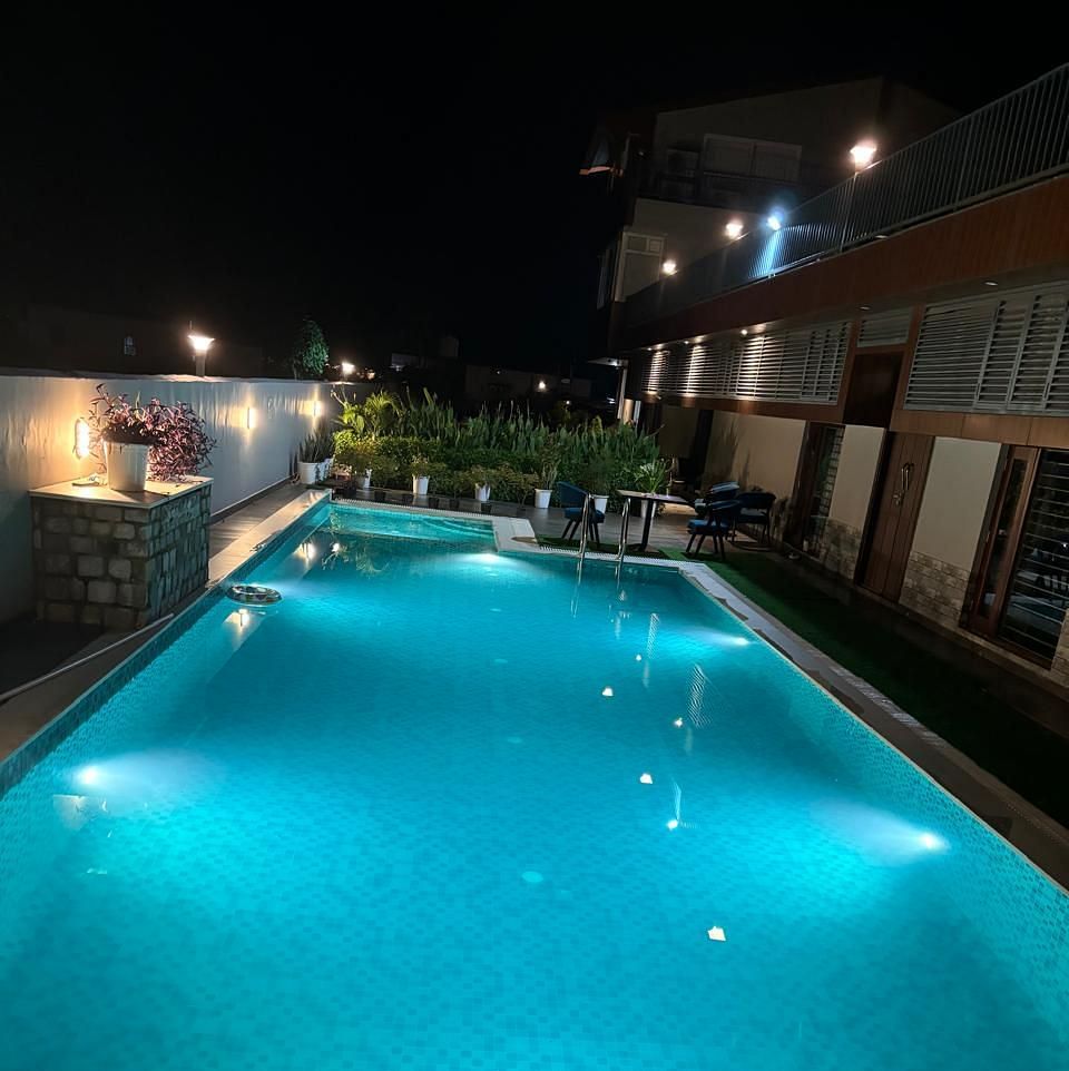 image of the swimming pool taken during the night at Eminence The Corbett