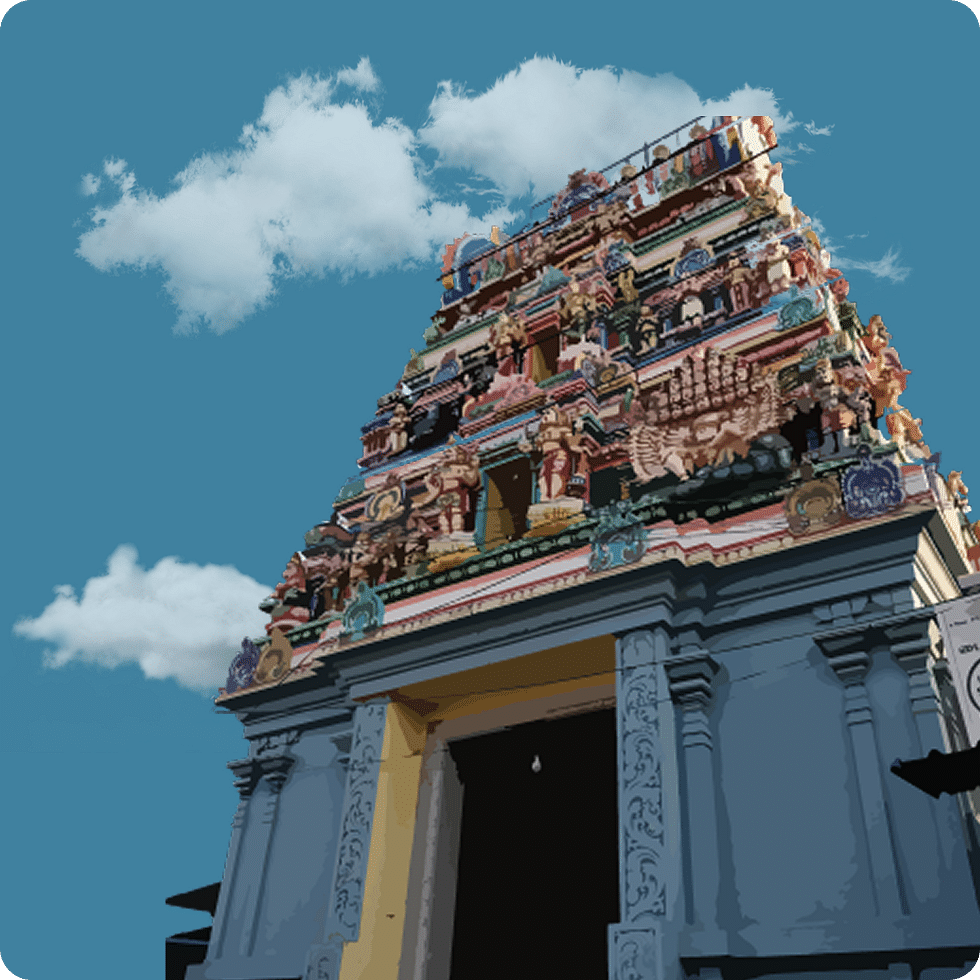 Vividly coloured gopuram of a temple with detailed sculptures and ornaments.