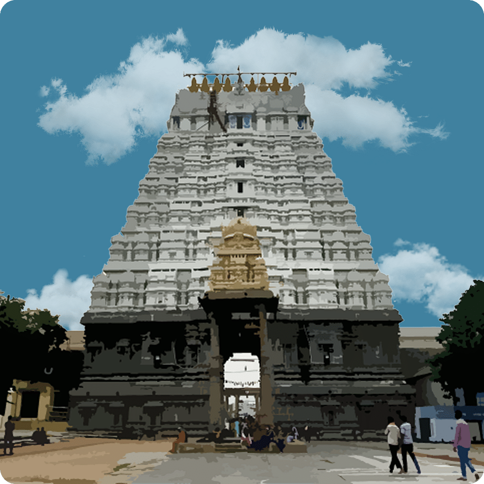 Towering entrance of a temple with white and ochre tones standing tall.