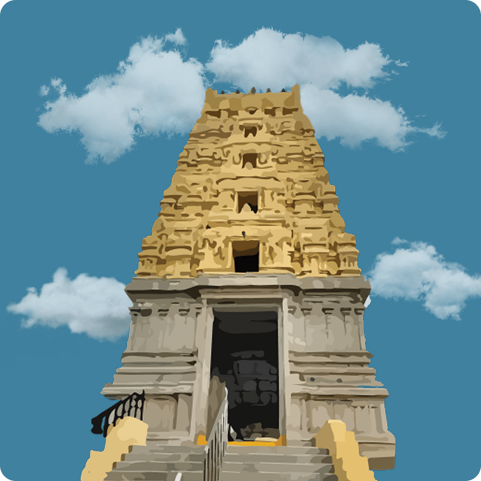 Golden-hued gopuram of a temple with rich intricate details.
