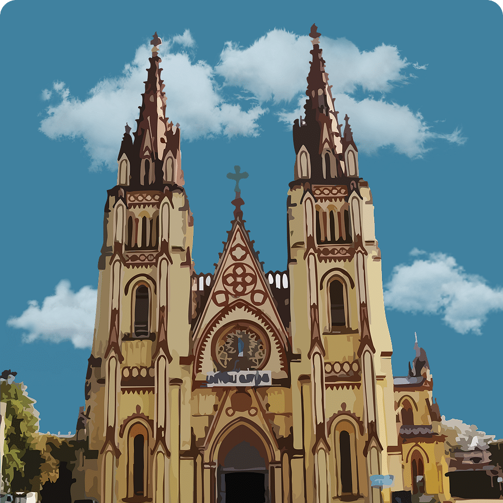 A grand Gothic-style church with twin spires under a bright blue sky, surrounded by greenery.