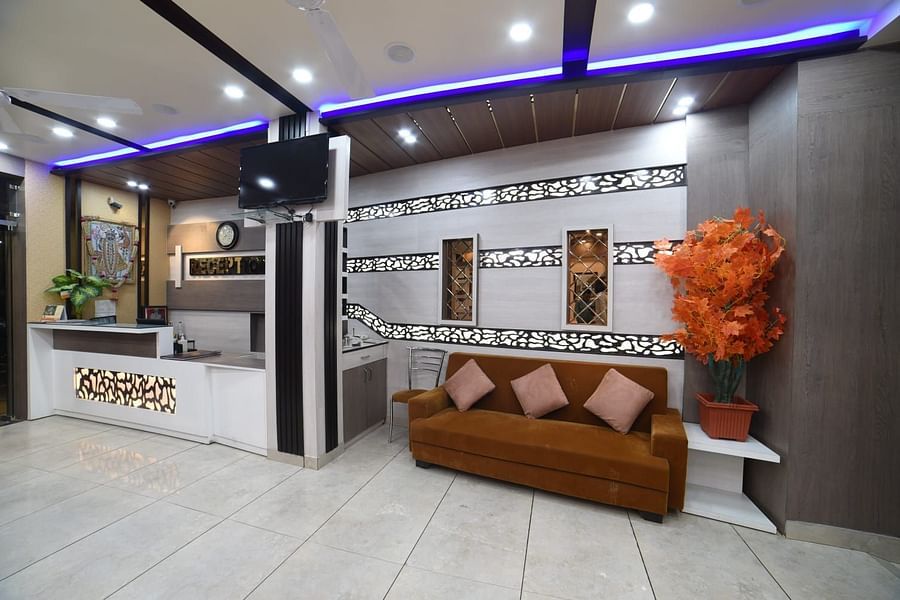 Sofa and the reception counter at Hotel Panchvati Inn