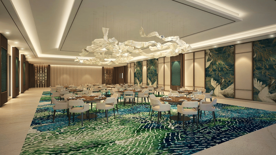 Skywings Sarovar Portico Mathura restaurant 3D render with decorative mosaic feature wall, round dining tables, chandelier, and bright recessed lighting.
