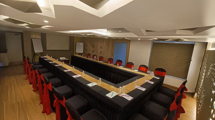 Side veiw of a boardroom with tables and chairs at The Oriental Residency