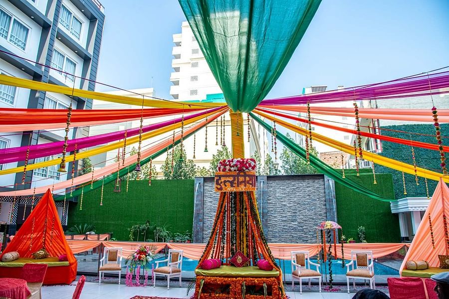 alt-text A low angle shot of a decorated event space beside the pool | Sun Park Hotel & Banquet, Chandigarh - Zirakpur