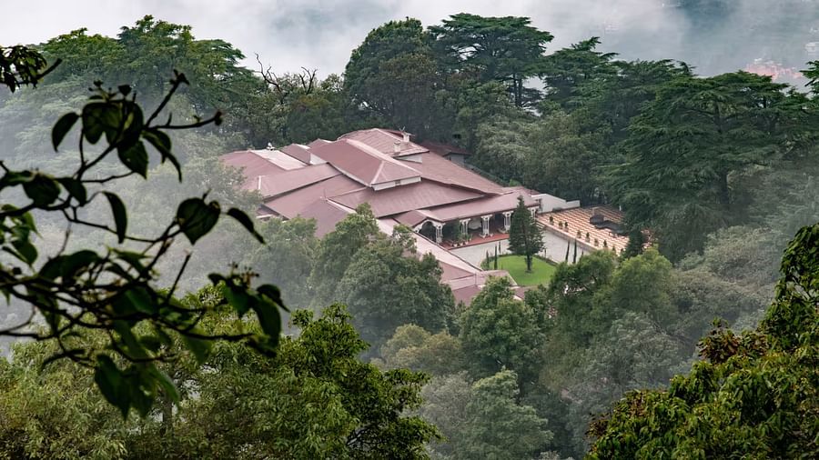 aerial view shot of The Claridges Nabha Residence in Mussoorie surrounded by lush green forest