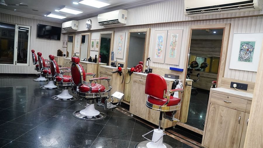 a line of salon chairs facing the mirror - Mayfair Lagoon, Bhubaneswar