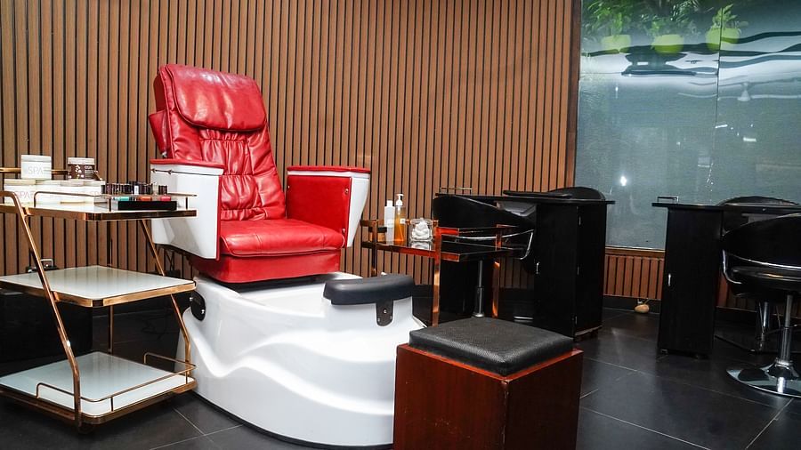 a salon rotating chair with a pedicure sink below it - Mayfair Lagoon, Bhubaneswar
