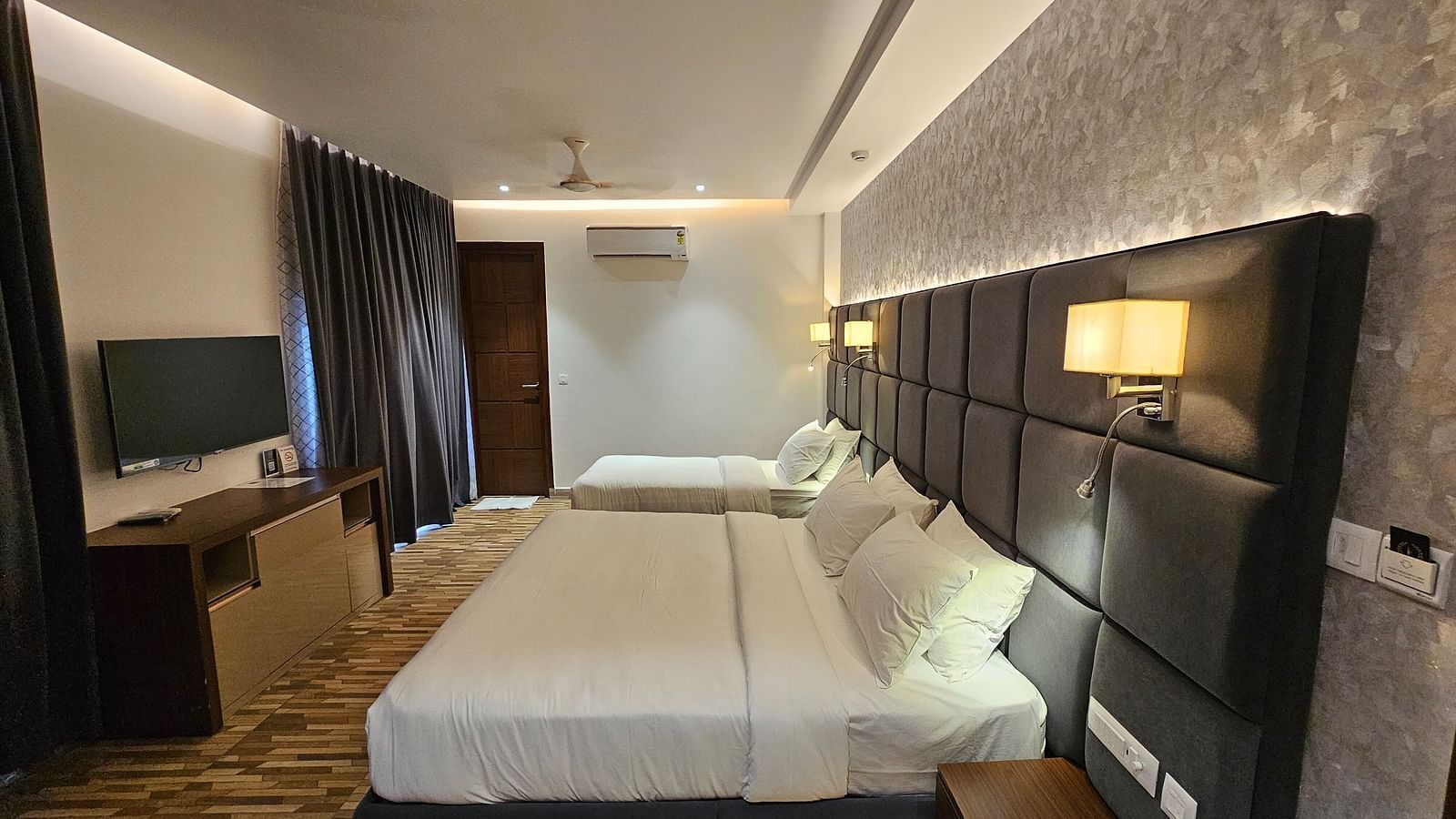 Full view image of the Family Executive room featuring a double bed along with a wall mounted television in front of it at Eminence The Corbett