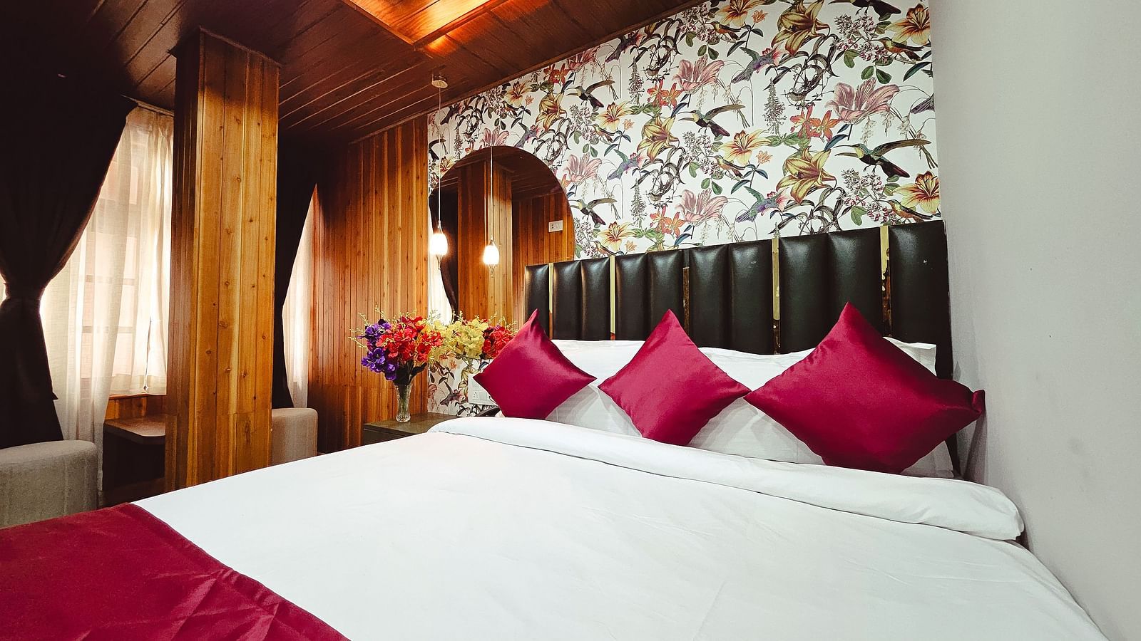 Premium room with wooden beams and windows