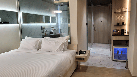 Image of a double bed in the Double 6ix Sea View with Jacuzzi Double Sized Bed at 6ix Seashore Hotel, Port Blair