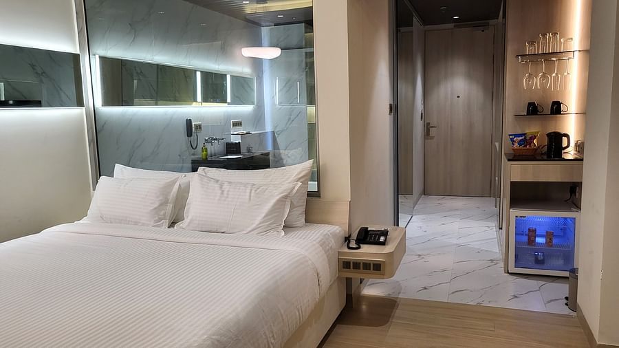 Image of a double bed in the Double 6ix Sea View with Jacuzzi Double Sized Bed at 6ix Seashore Hotel, Port Blair