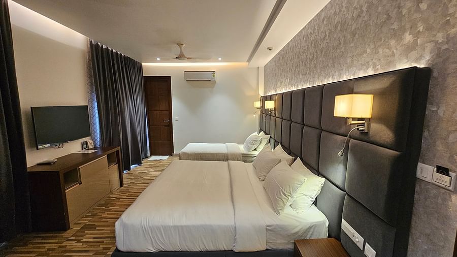 Full view image of the Family Executive room featuring a double bed along with a wall mounted television in front of it at Eminence The Corbett