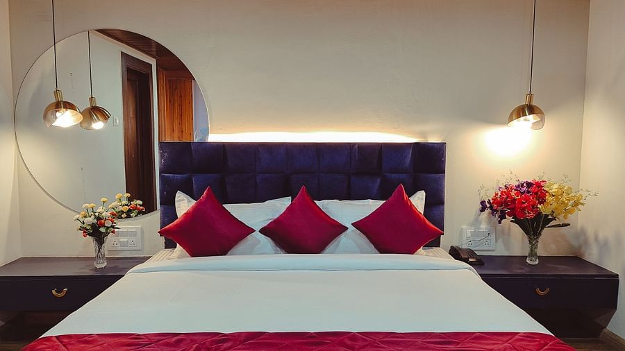 Premium room at sumi stays with mirror and side desks