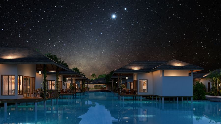 A view of Lagoon villas over the waterbody with many start in the sky - Ananta Spa and Resort, Ajabgarh